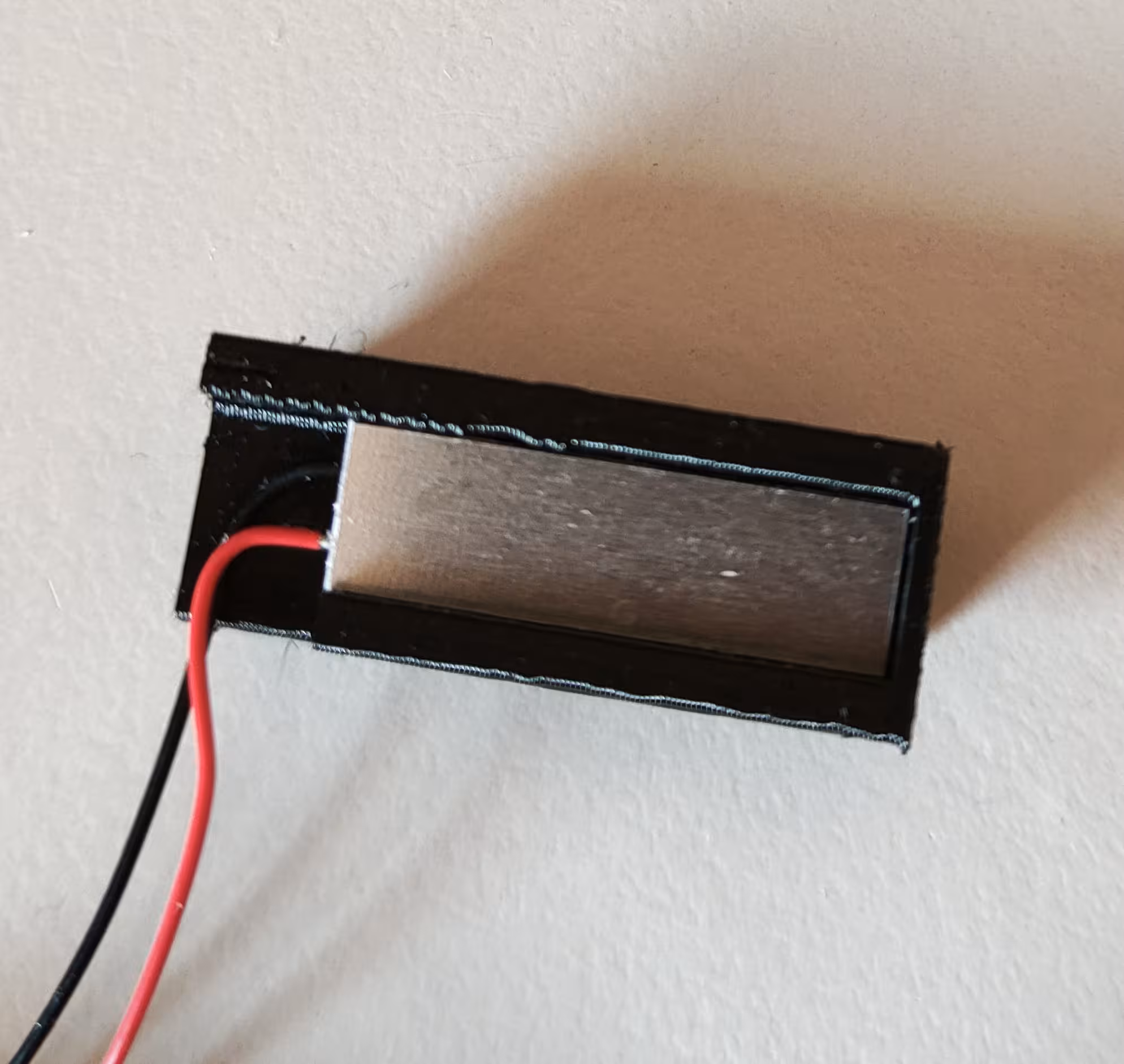 COB LED module pushed with LED facing down onto the Filament Path 3d print piece with cables bent