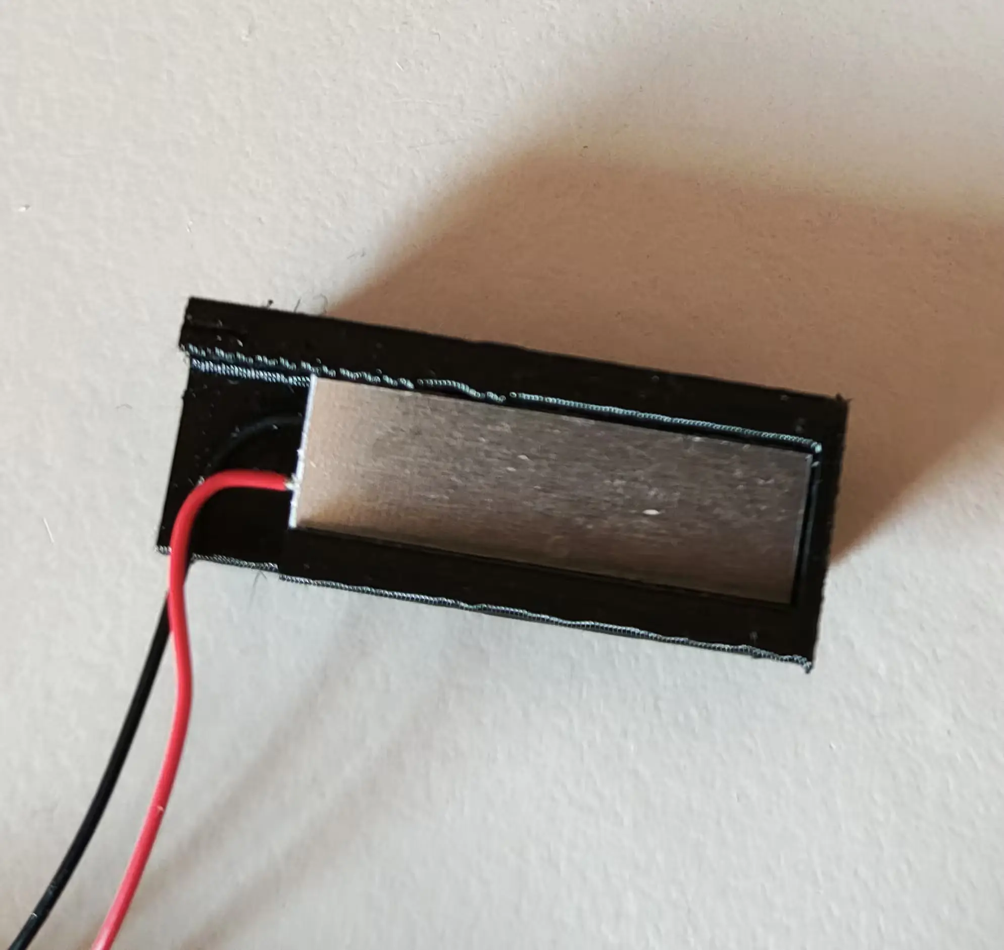 COB LED module pushed with LED facing down onto the Filament Path 3d print piece with cables bent