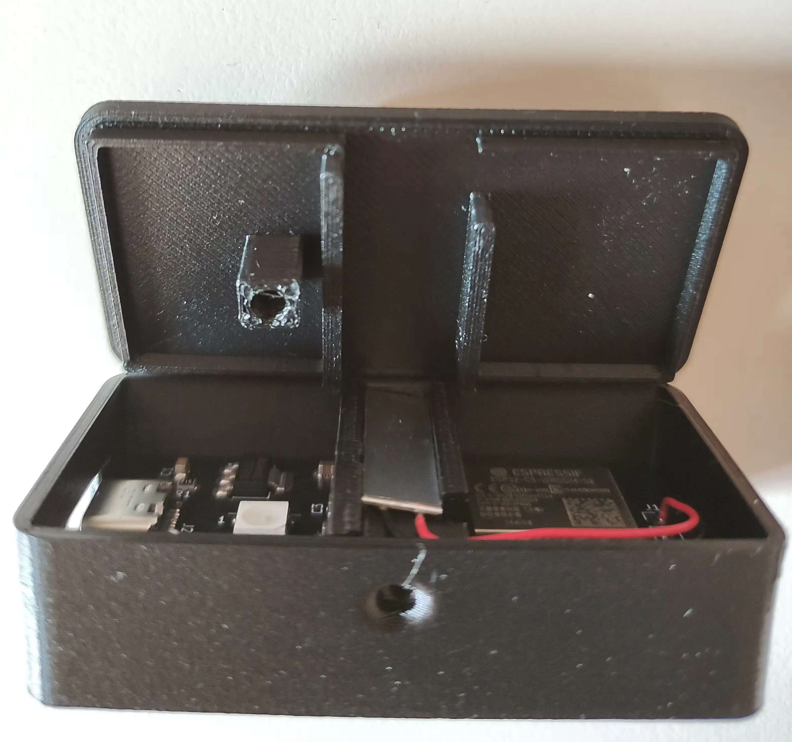 Lid carefully aligned with rest of case. Made out of black matte filament, PCB is already inserted